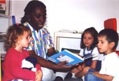 Volunteer reading at a day care